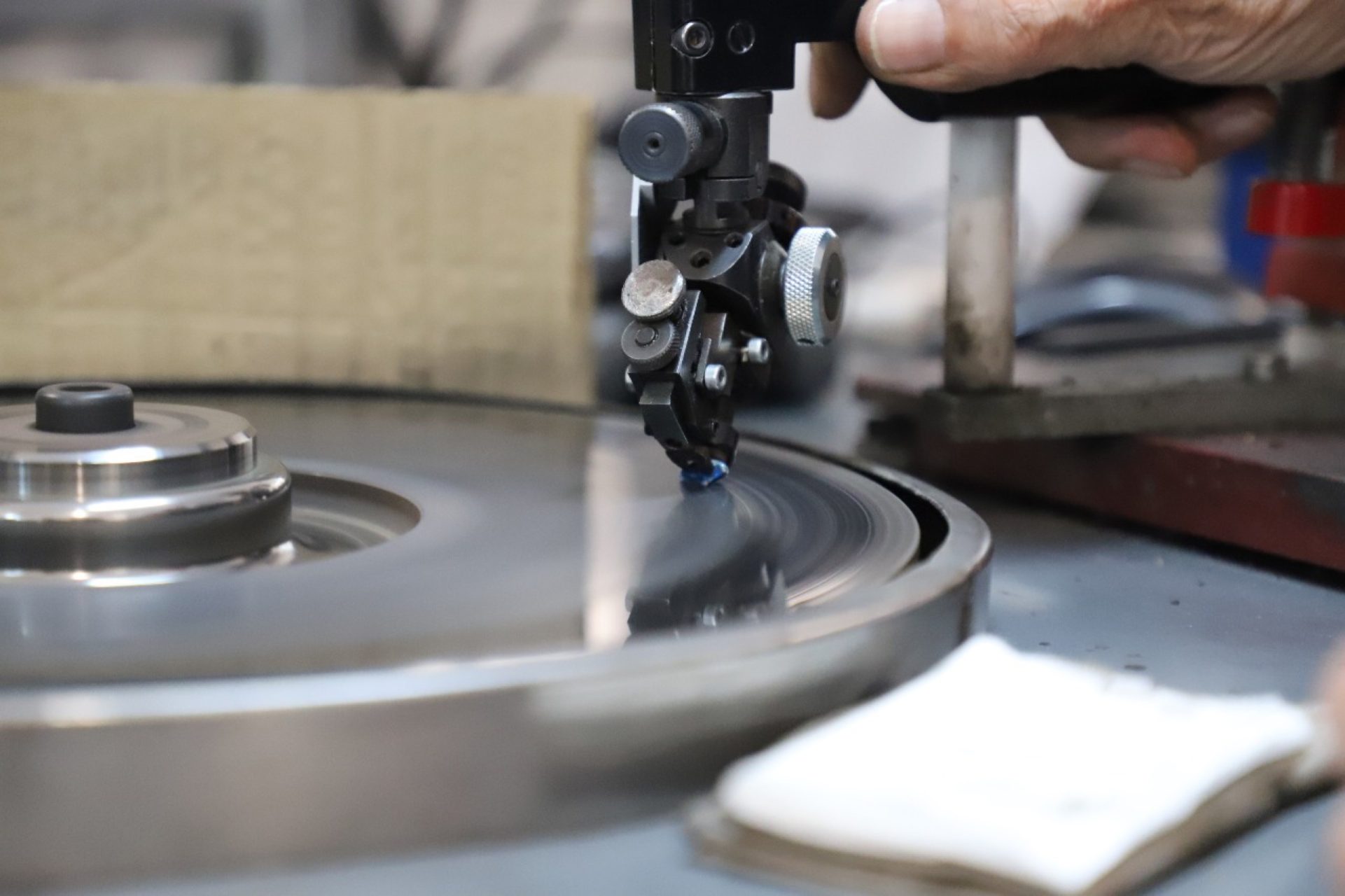 The Luna Azul on the cutting wheel — master cutter shaping the rough crystal
